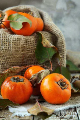 金黄成熟柿子水果秋天丰收秋分立秋摄影图