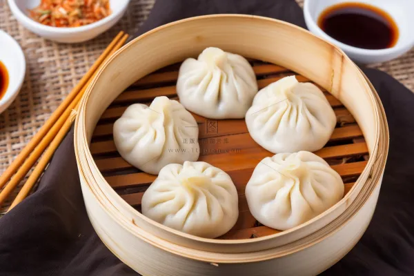 灌汤小笼包美食早点摄影图