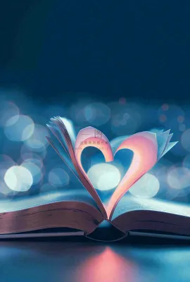 翻开的书本爱心形知识阅读教师节摄影图