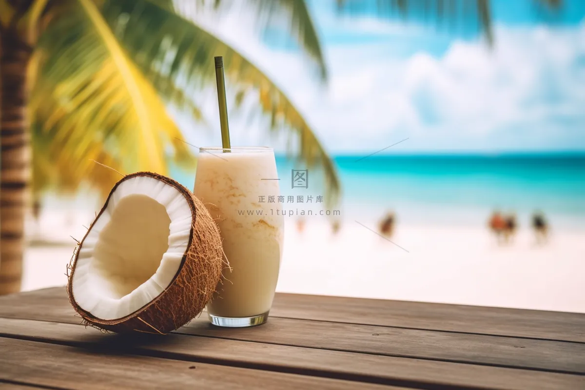 夏日沙滩椰子奶茶海边悠闲度假摄影图 