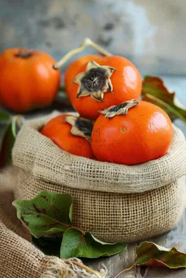 金黄成熟柿子水果秋天丰收秋分立秋摄影图