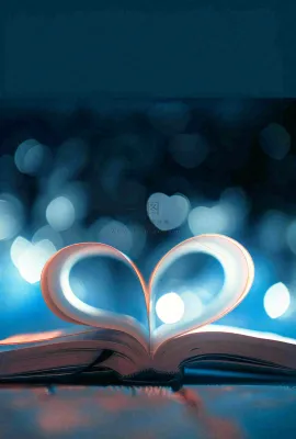 翻开的书本爱心形知识阅读教师节摄影图