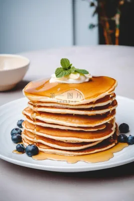 蜂蜜松饼塔美味糕点甜点摄影图